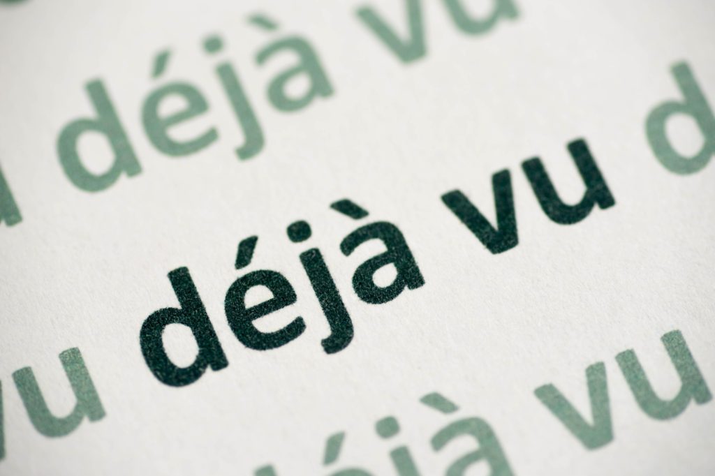 Word déjà vu printed on white paper macro
