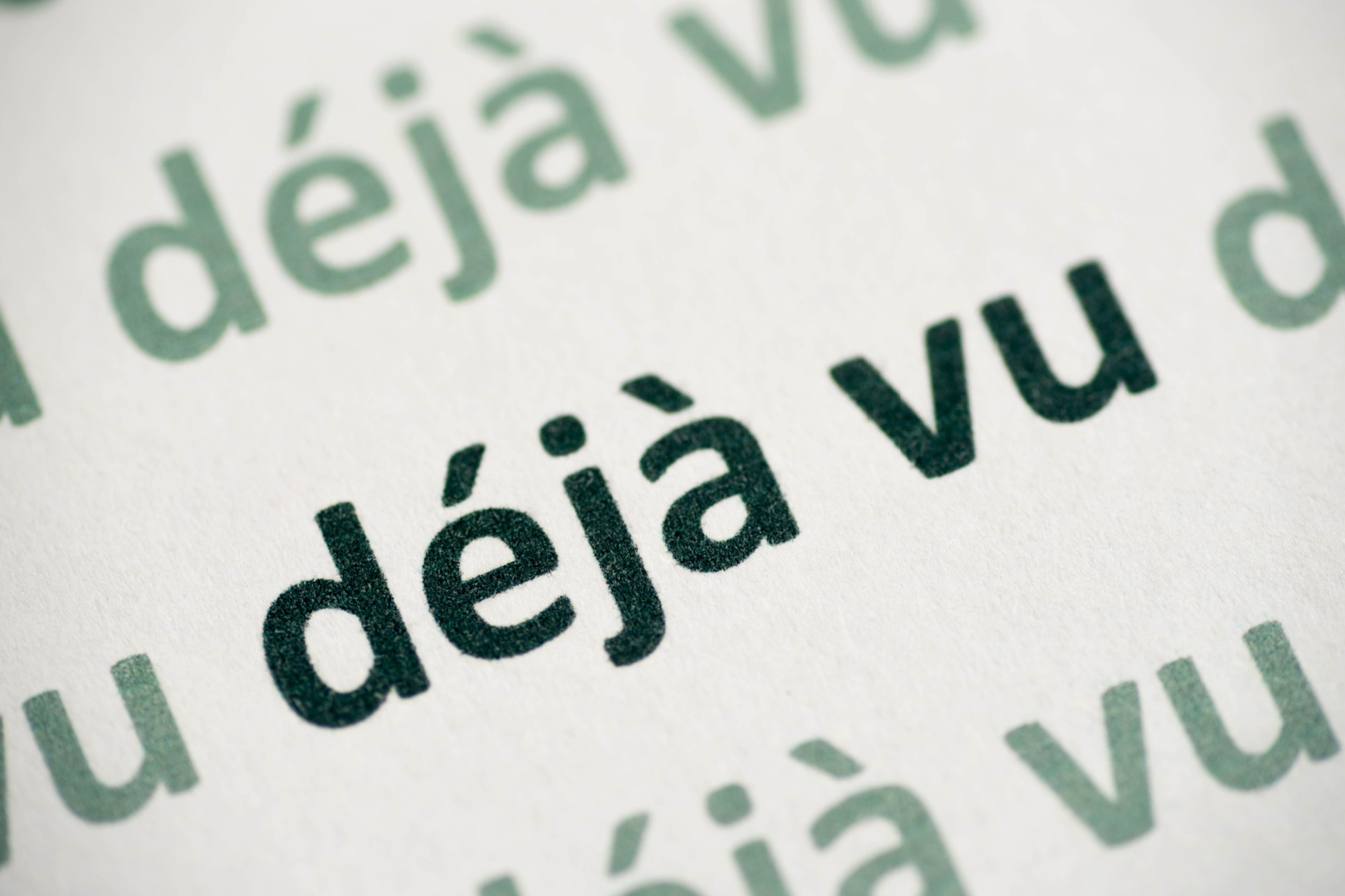 Word déjà vu printed on white paper macro