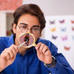 Student entomologist studying new species of butterflies