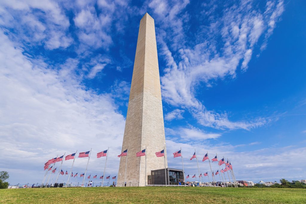 United States flags around the Washington Monument in Washington DC