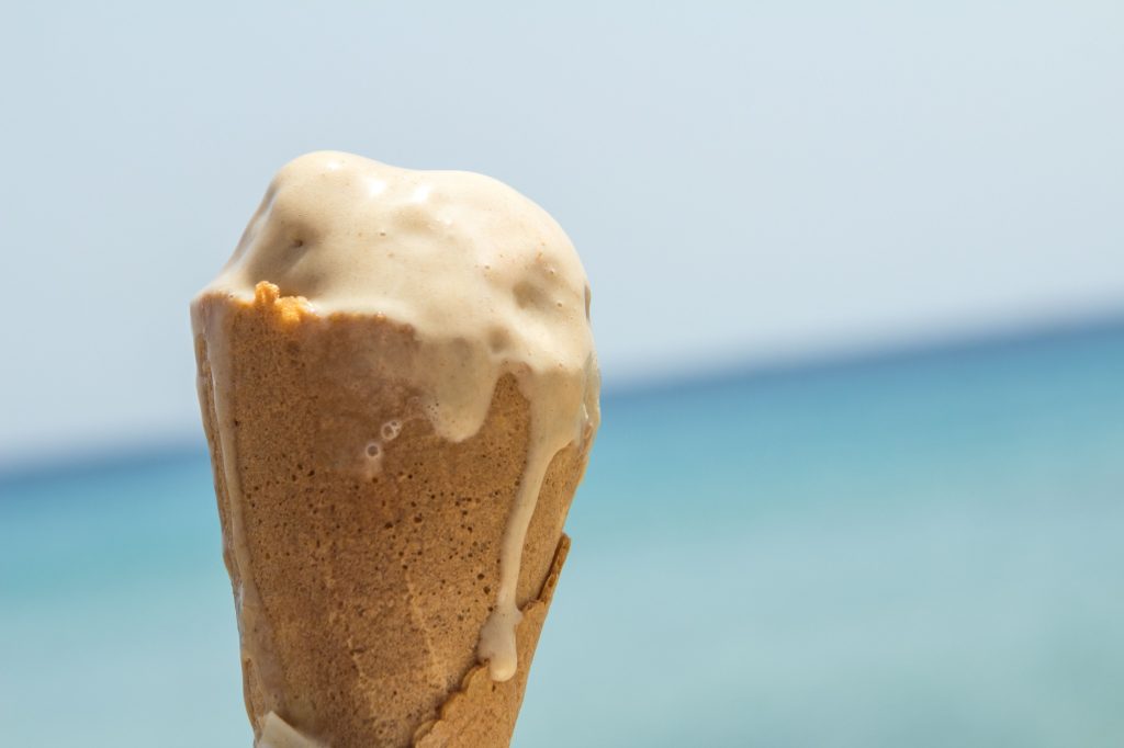 melted ice cream cone in a waffle cone under the sun