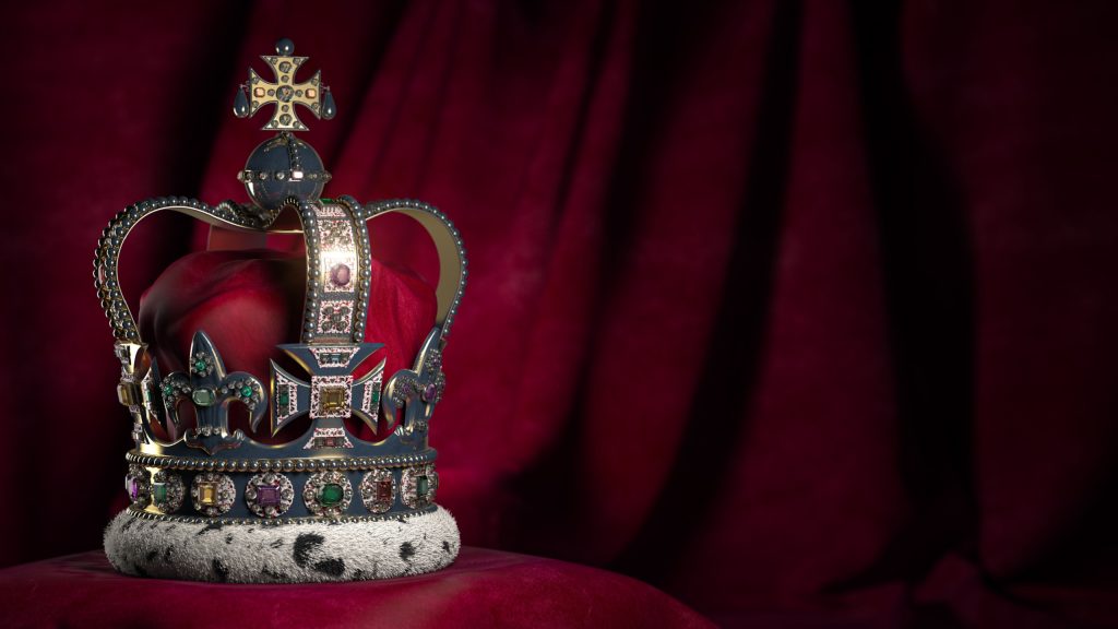 Royal golden crown with jewels on pillow on pink red background. Symbols of UK United Kingdom monarchy. 3d illustration