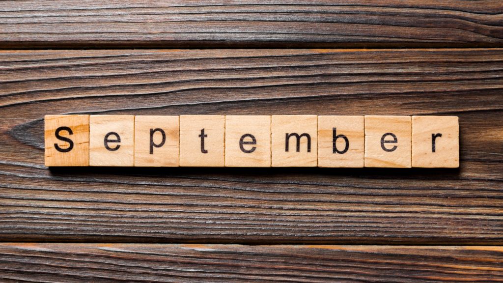 September 2025 - small spiral desktop calendar, time and business concept