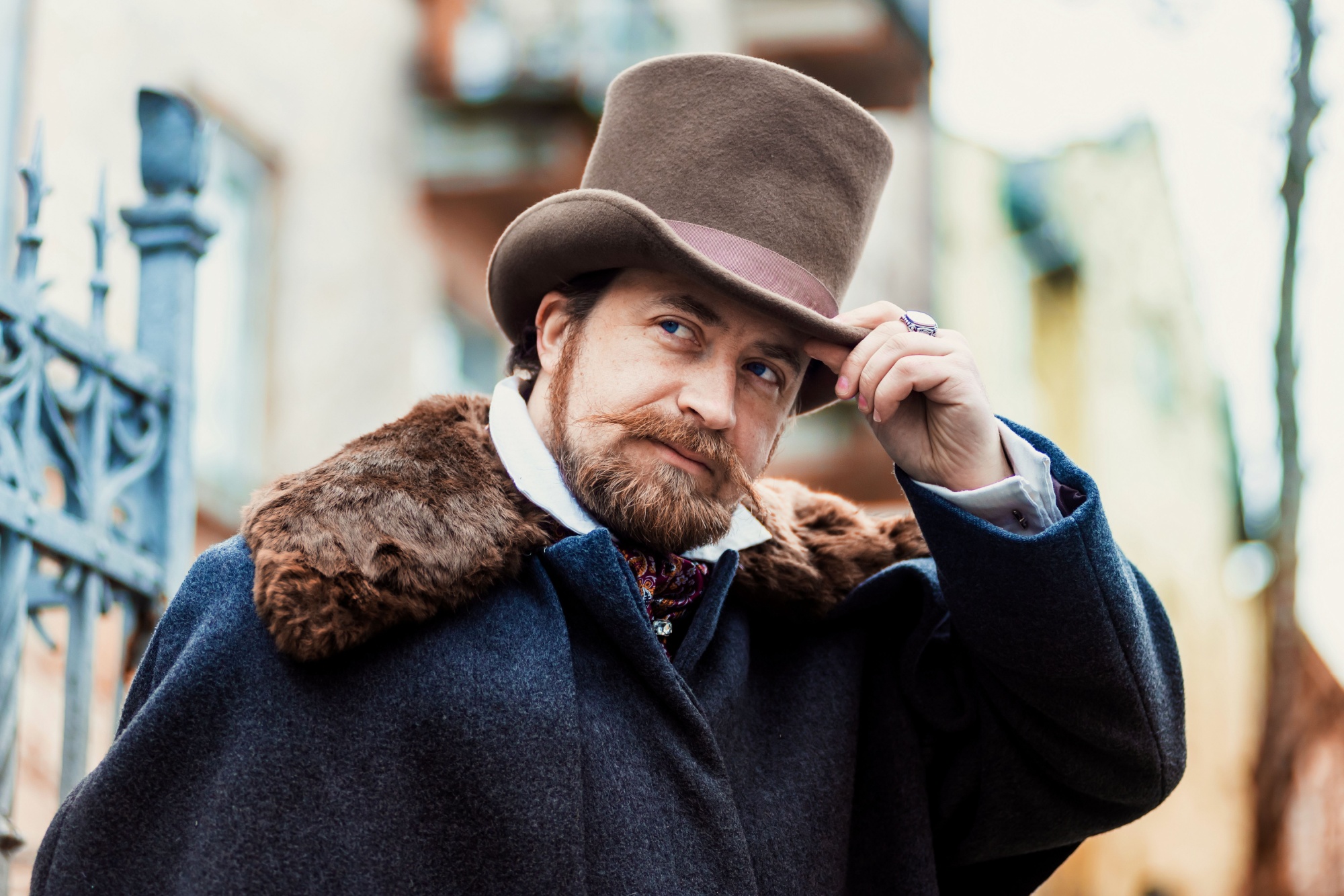 Portrait of a man in elegant suit and hat, retro old fashioned style