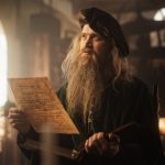 Portrait of an Old Renaissance Male Inventor Reading a Book and Thinking about Ideas of Innovation of the Times. A Curious Librarian Getting Knowledge and Wisdom from History Books