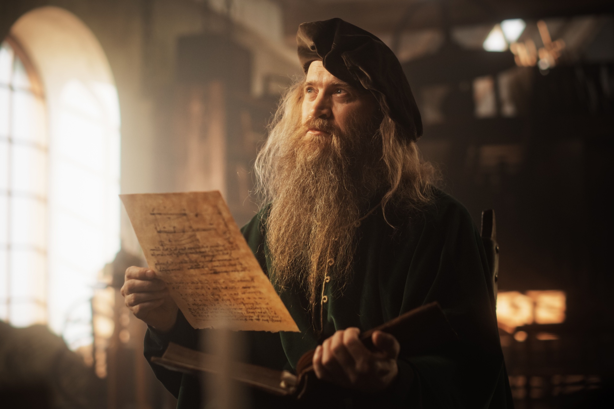 Portrait of an Old Renaissance Male Inventor Reading a Book and Thinking about Ideas of Innovation of the Times. A Curious Librarian Getting Knowledge and Wisdom from History Books