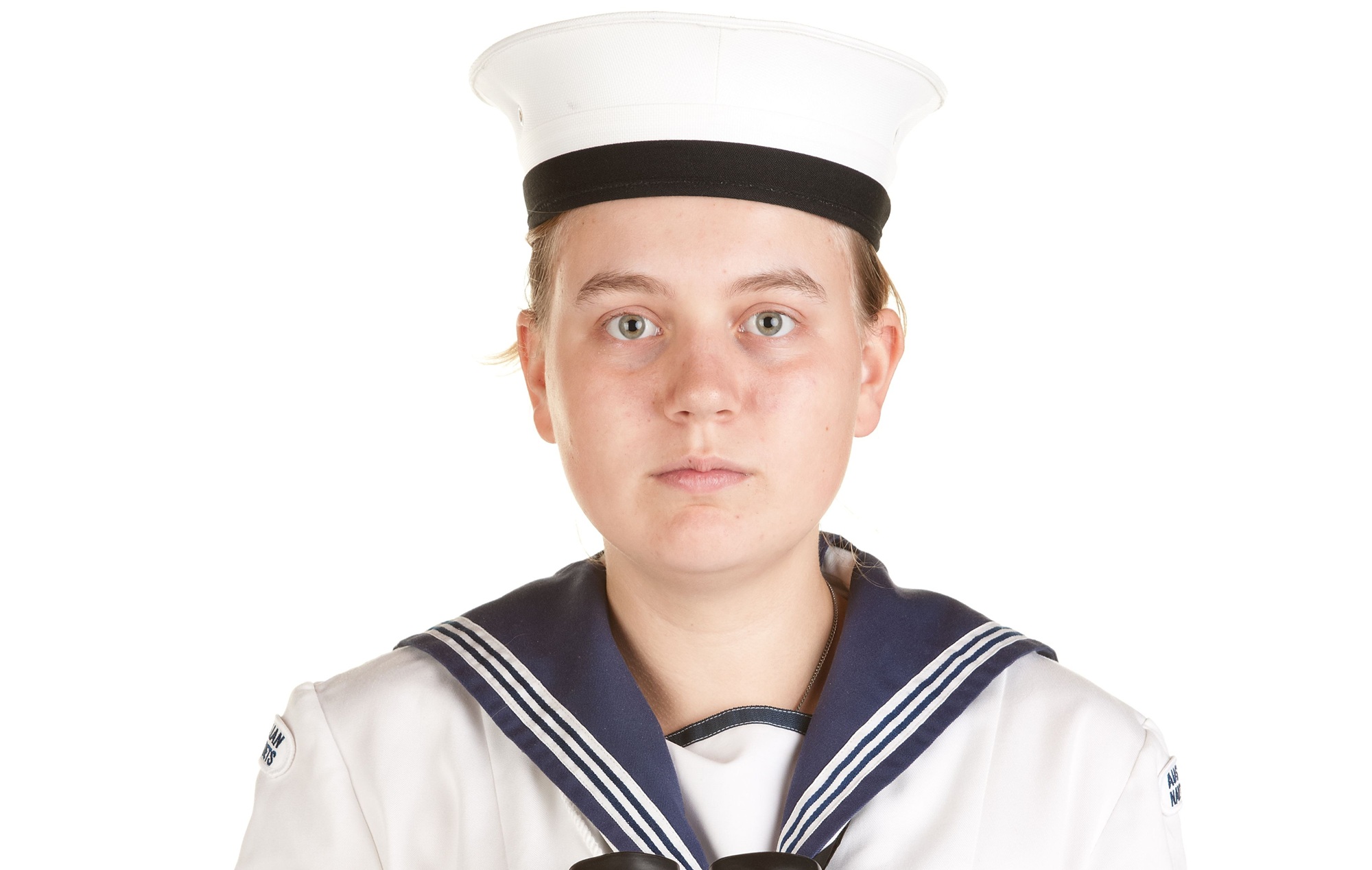 Young female navy sailor with binoculars isolated on white