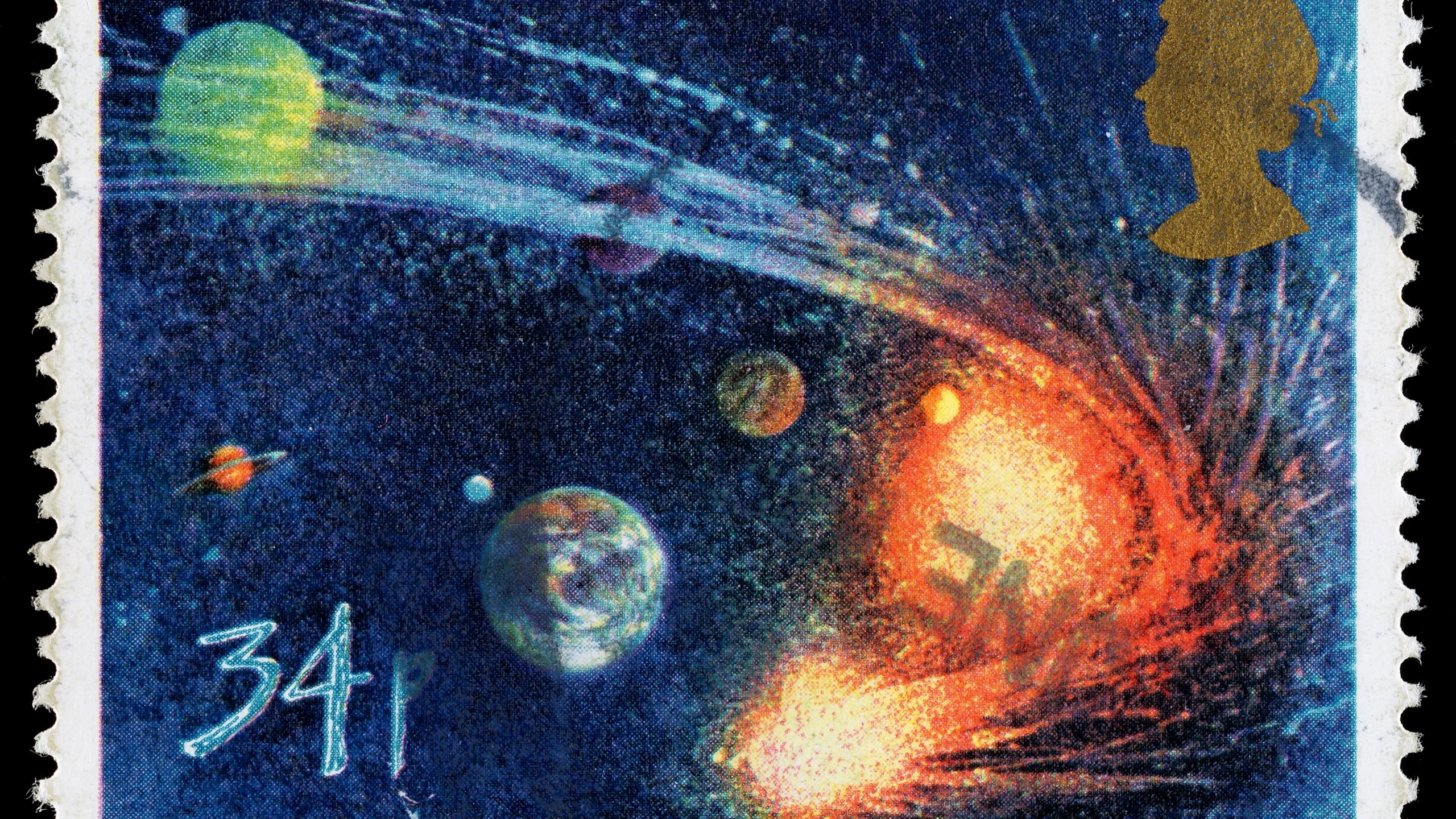 UNITED KINGDOM - CIRCA 1986: A used postage stamp printed in Britain celebrating the Appearance of Halleys Comet showing Comet Orbiting the Sun and Planets, circa 1986