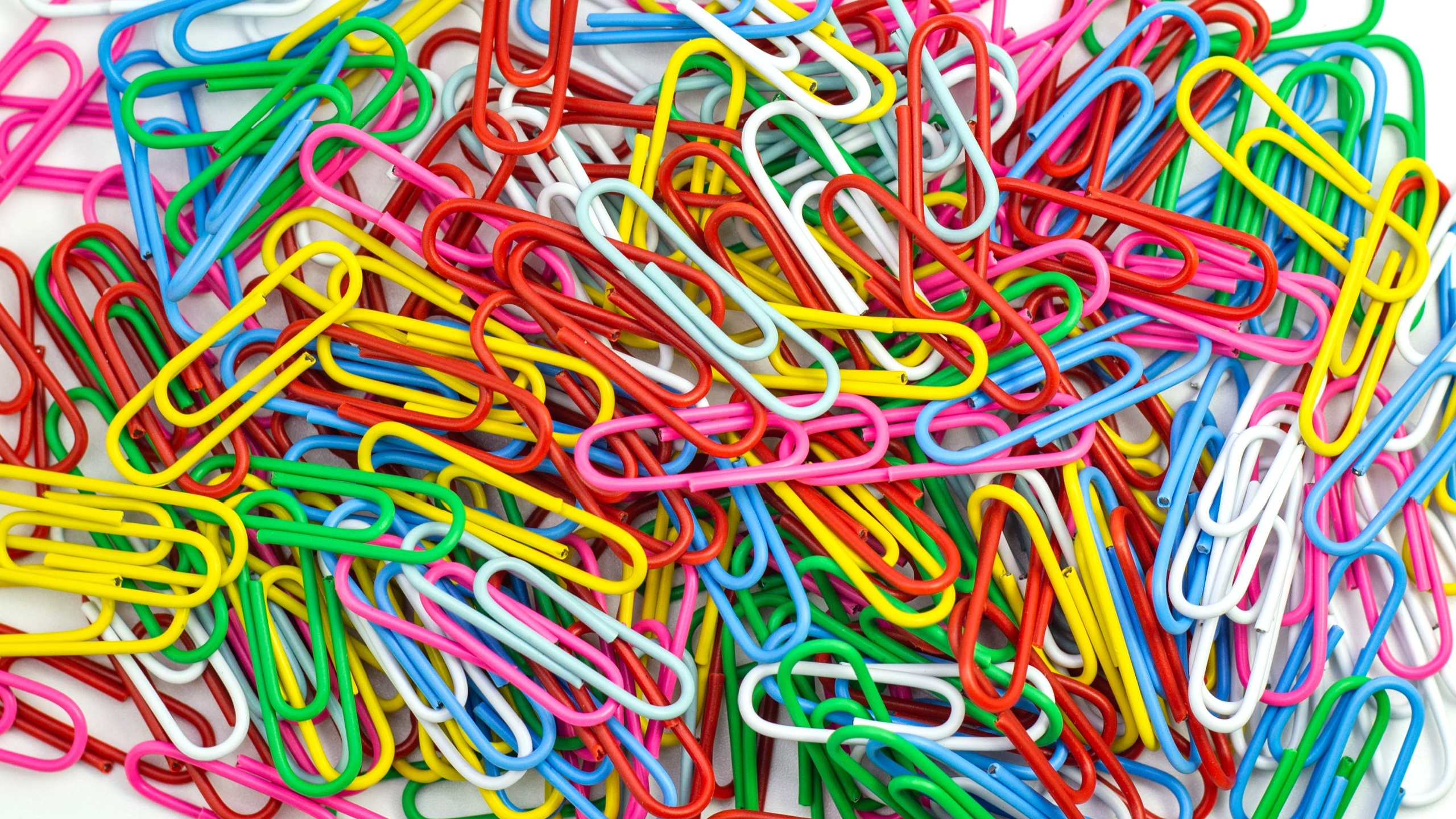 Collection of colorful Paper clips on white background