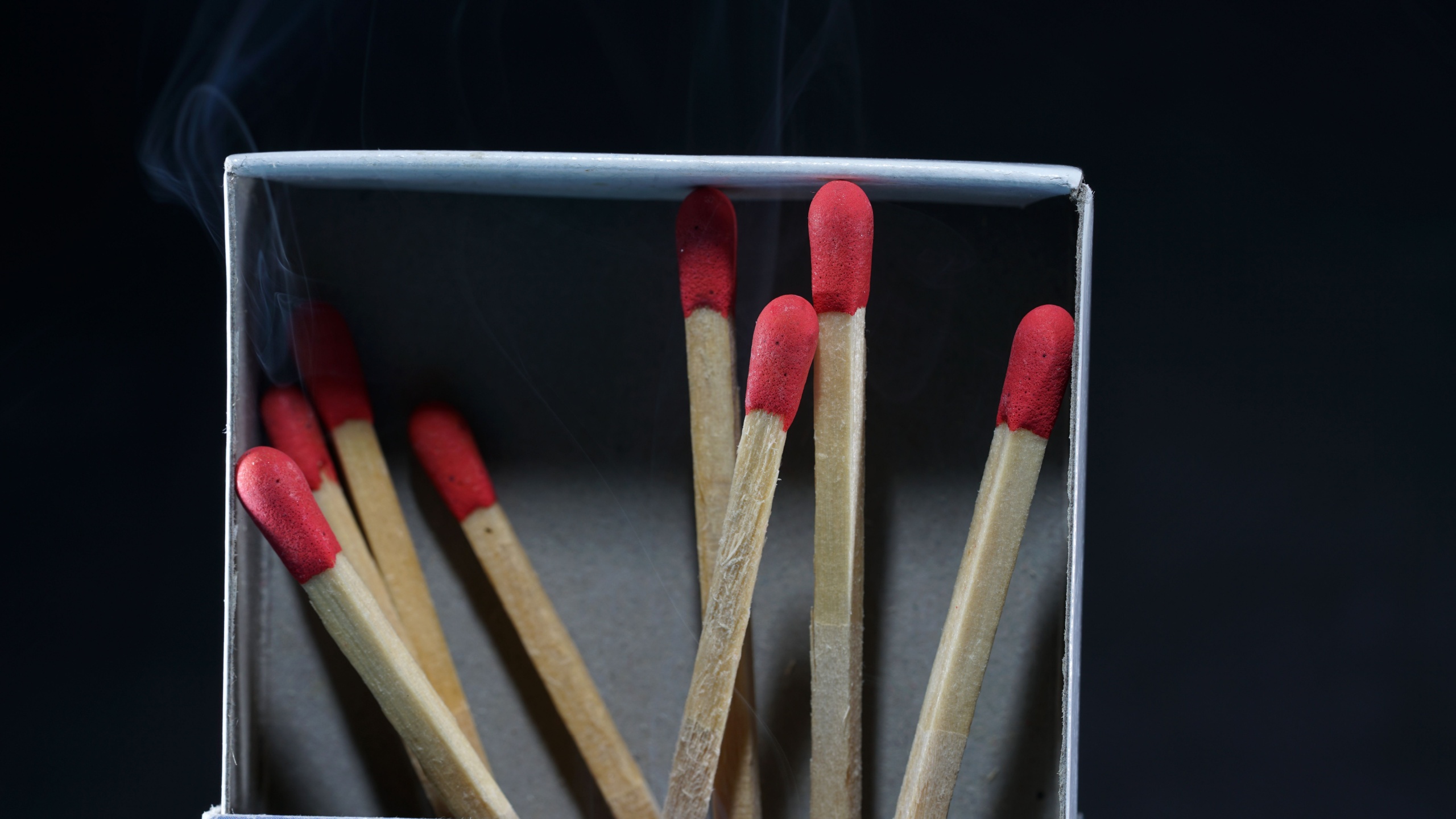 An abstract closeup macro shot of steaming matches