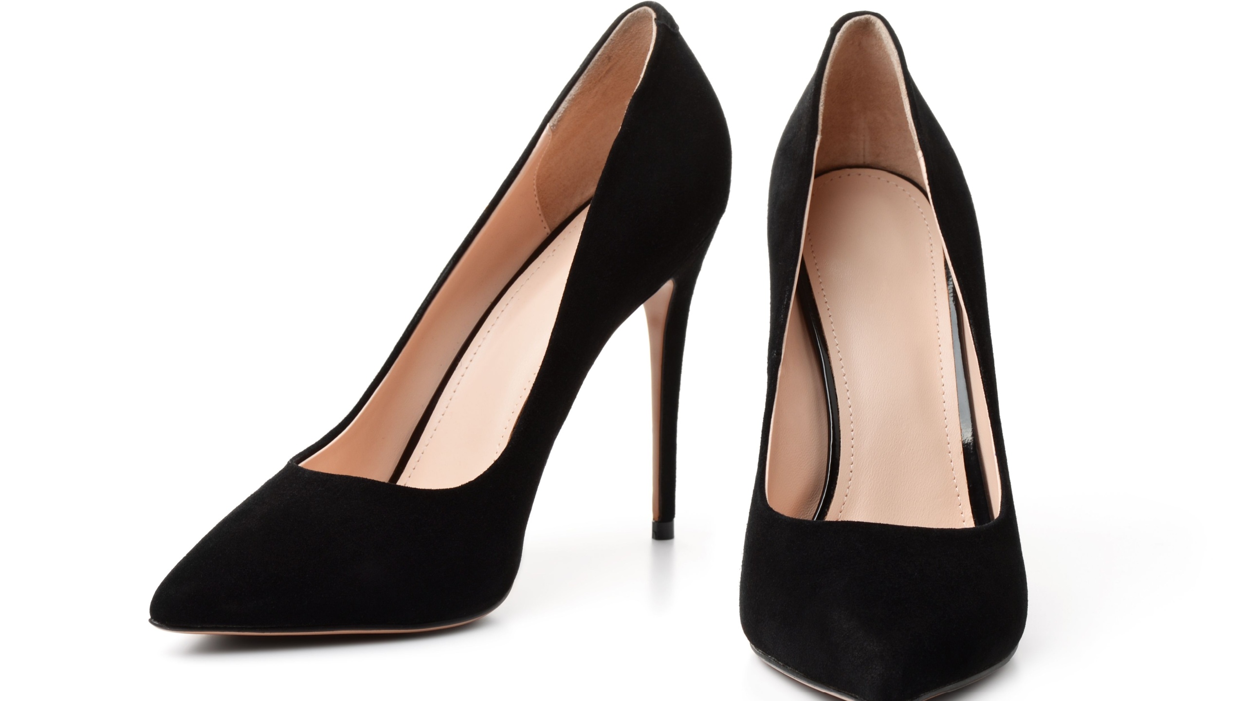 Pair of black suede high heel shoes isolated on white