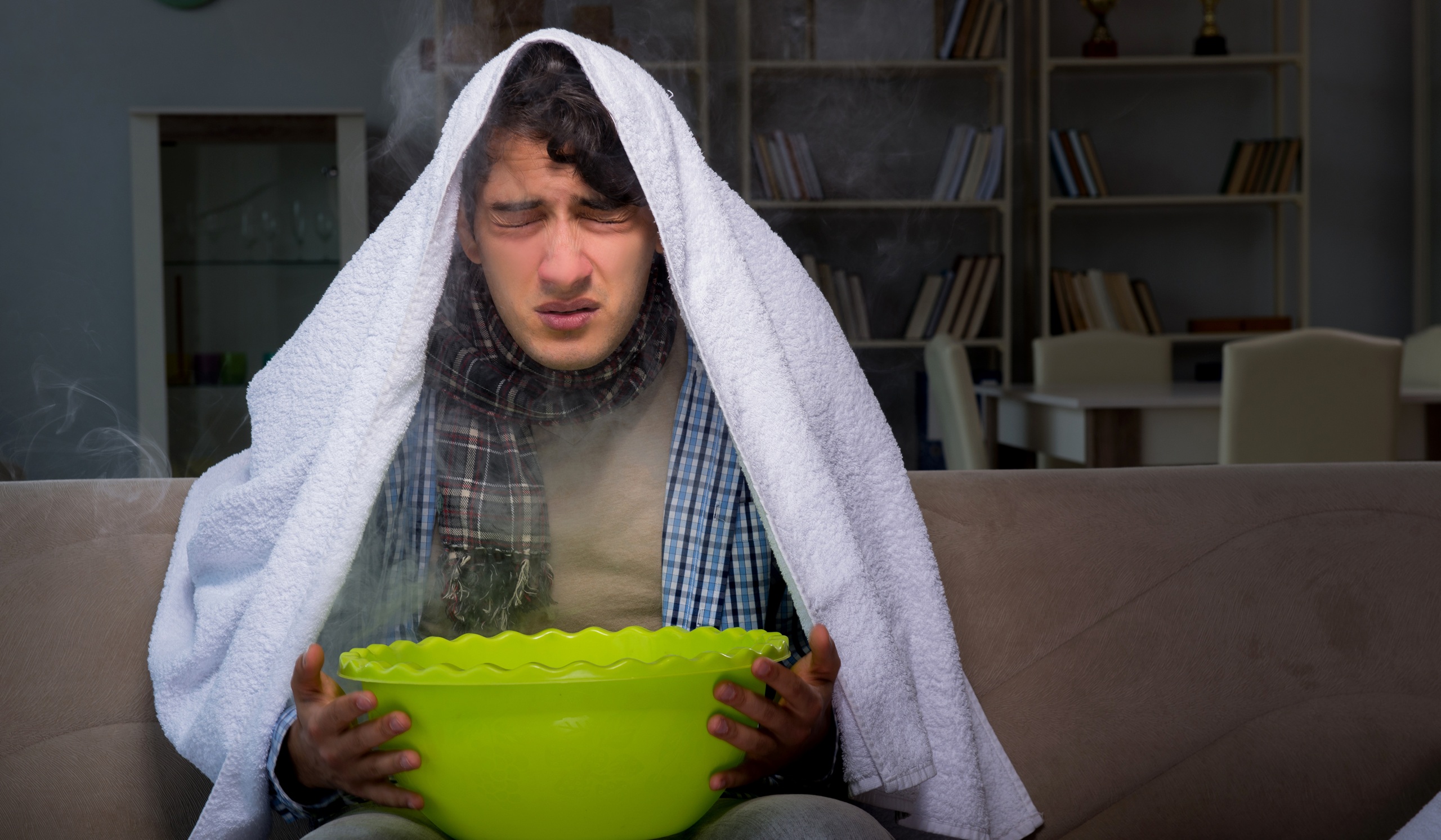 Sick man doing inhalation at night in home
