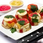 Portion of delicious chicken aspic on a plate isolated on white background