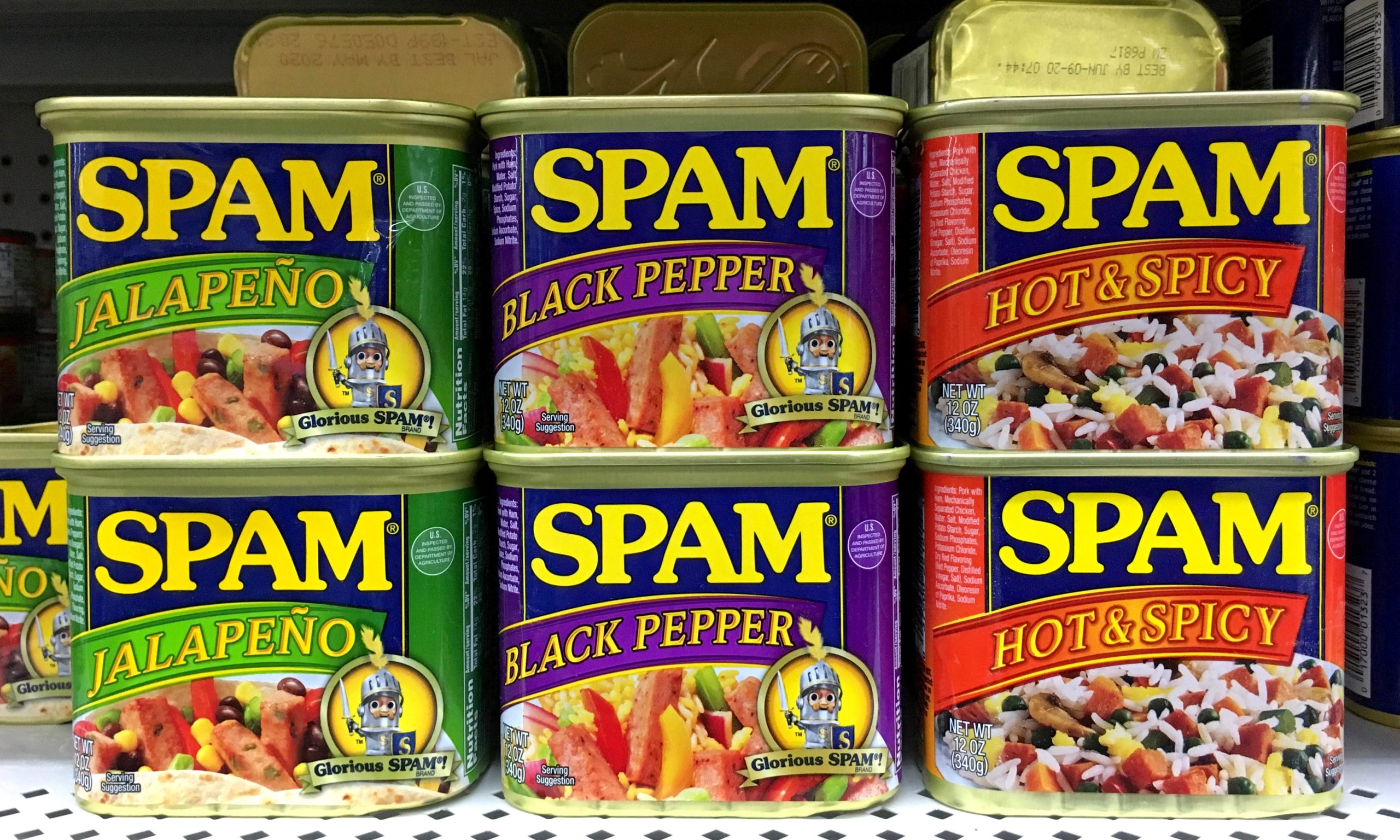 San Leandro, CA - August 24, 2017: Grocery store shelf with cans of Spam. A brand of canned cooked meat made by Hormel Foods Corp in 1937 it became popular worldwide after its use during World War II.