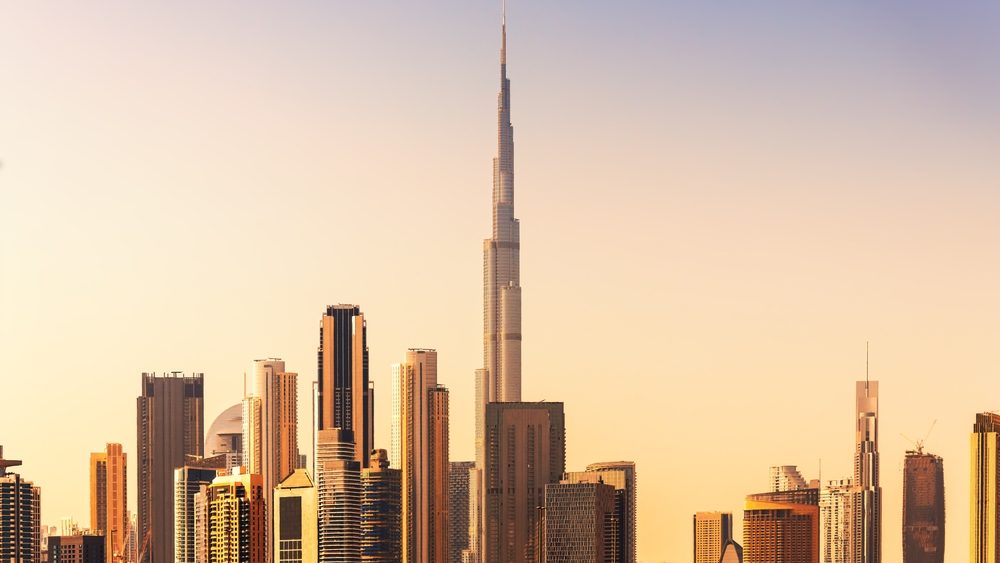 Dubai downtown skyline with modern skyscrapers at sunset. United Arab Emirates